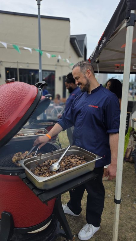 A chef serving from the grill