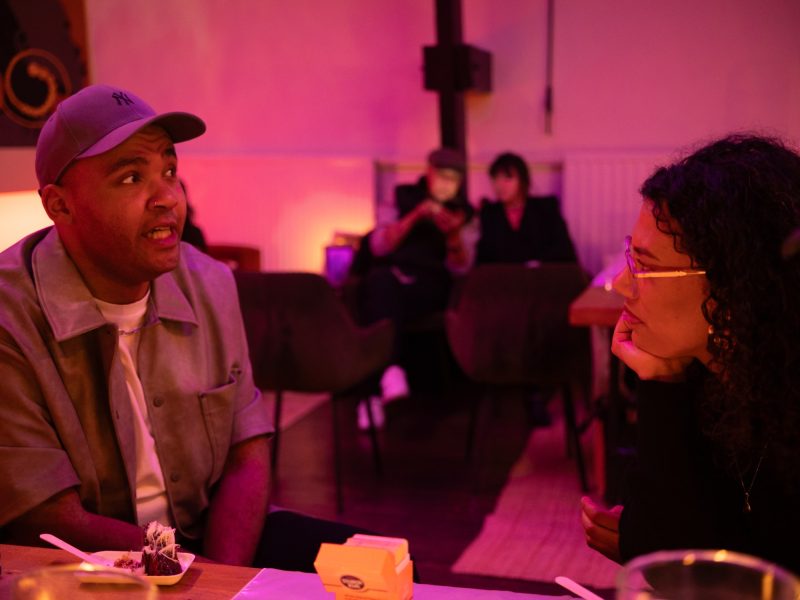 Two guests in conversation at the table