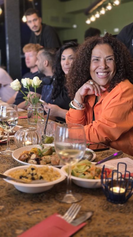 A guest smiling at the table