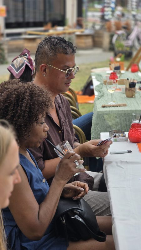 Guests chatting at the long table